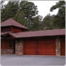 House before, with a single-story red garage
