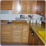 Kitchen before, with yellow counters
